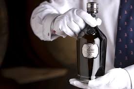 glenfiddich 50 year old single malt whisky bottle hands