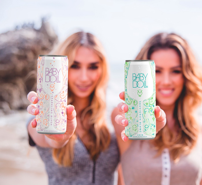 ladies holding Babydoll slimline wine in can New Zealand sauvignon blanc and sparkling pinot gris